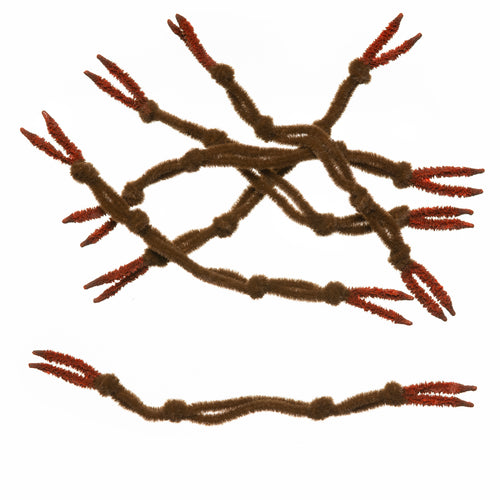 A collection of chenille crab claws arranged in a pattern on a white background, designed for use in fly tying for fishing.
