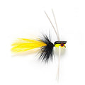 Fishing fly with yellow and black body on a white background