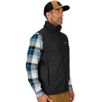 Man wearing a black Simms MEN's Fall Run Insulated Vest w/CRO Logo over a plaid shirt with a cap on a white background