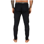 Black pants worn by a person on a white background