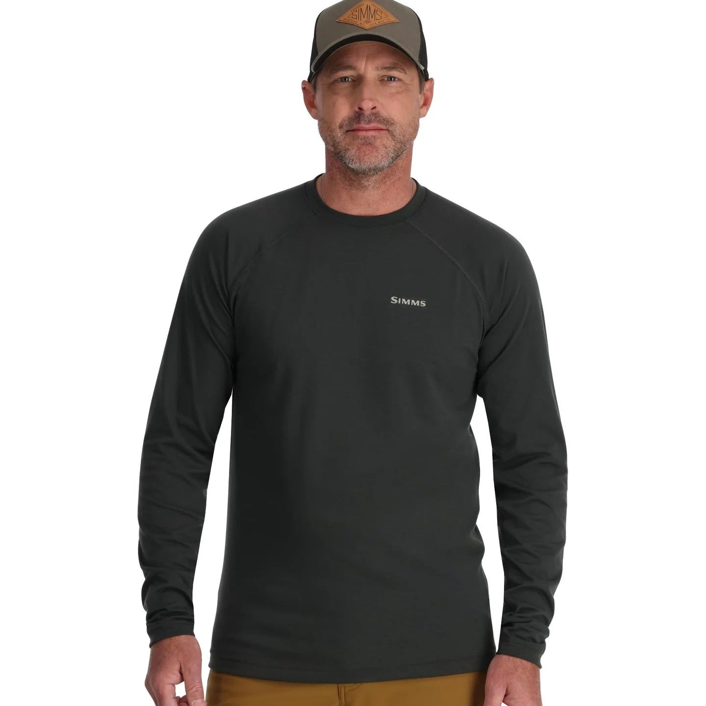 Man wearing a black long-sleeve shirt with a logo on a white background