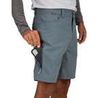 Person wearing gray Simms MEN's Skiff Shorts with a white background