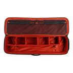 Open red Simms Tailwind Rod & Reel Vault with compartments on a white background