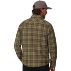 Man wearing a plaid Simms MEN's Coldweather Shacket w/CRO Logo and cap on a white background