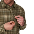 Man wearing a green plaid Simms MEN's Coldweather Shacket w/CRO Logo on a white background