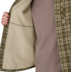Close-up of a plaid Simms MEN's Coldweather Shacket w/CRO Logo with a brown shirt underneath on a white background