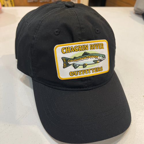 Black cap with Chagrin River Outfitters patch featuring a fish on a white surface.