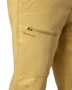 Beige pants with a visible Simms logo on a white background