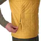 Yellow quilted vest with a person's hand opening the zipper on a white background