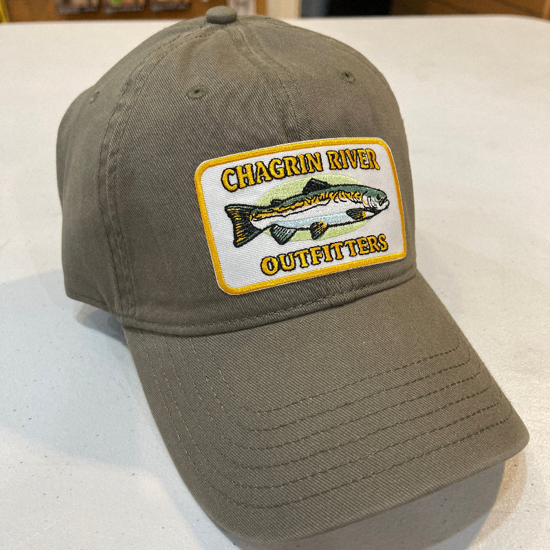 Brown cap with a logo patch on a white surface