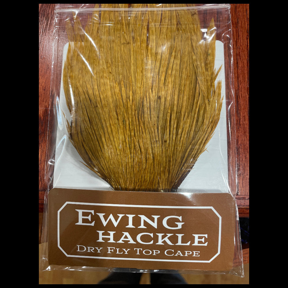 Ewing Hackle dry fly top cape packaging on a wooden surface