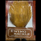 Ewing Hackle dry fly top cape packaging on a wooden surface