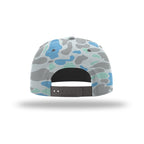 The back view of a snapback cap featuring a blue, gray, and mint green camouflage pattern, with a black adjustable strap.