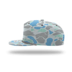 A structured flat-brim cap with a light gray base and an abstract organic camouflage pattern in shades of blue, mint green, and medium gray, shown from a side profile on a white background with a soft drop shadow.