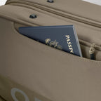 A green Orvis Carry-It-All fishing rod case with a shoulder strap and brand logo visible.