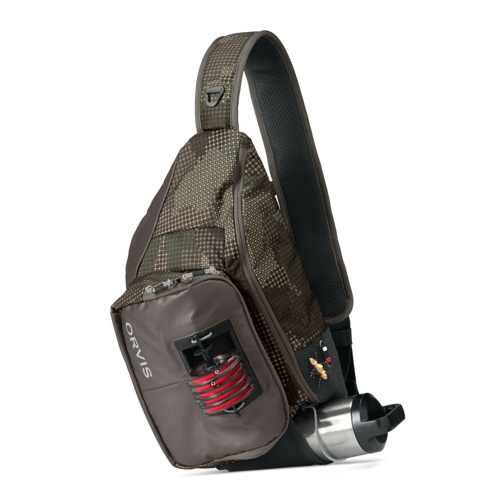A gray Orvis sling pack designed for fly-fishing, featuring multiple storage compartments and oa water bottle holder.