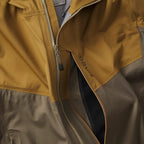 Close-up of a yellow and gray jacket with 'Orvis' branding.