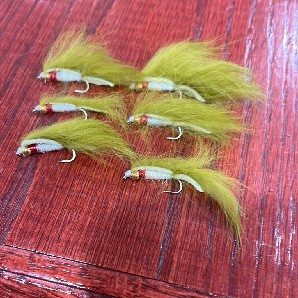 A set of six Lite Brite Zonker Fly fishing lures with green, yellow, and red colors on a wooden surface.