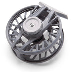 Gray fly fishing reel on a white background