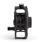 Black fishing reel on a white background