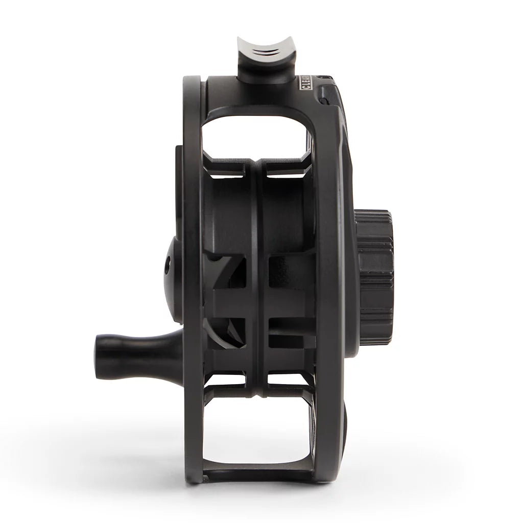 Black fishing reel on a white background
