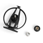 Black metal fly fishing reel with additional components on a white background
