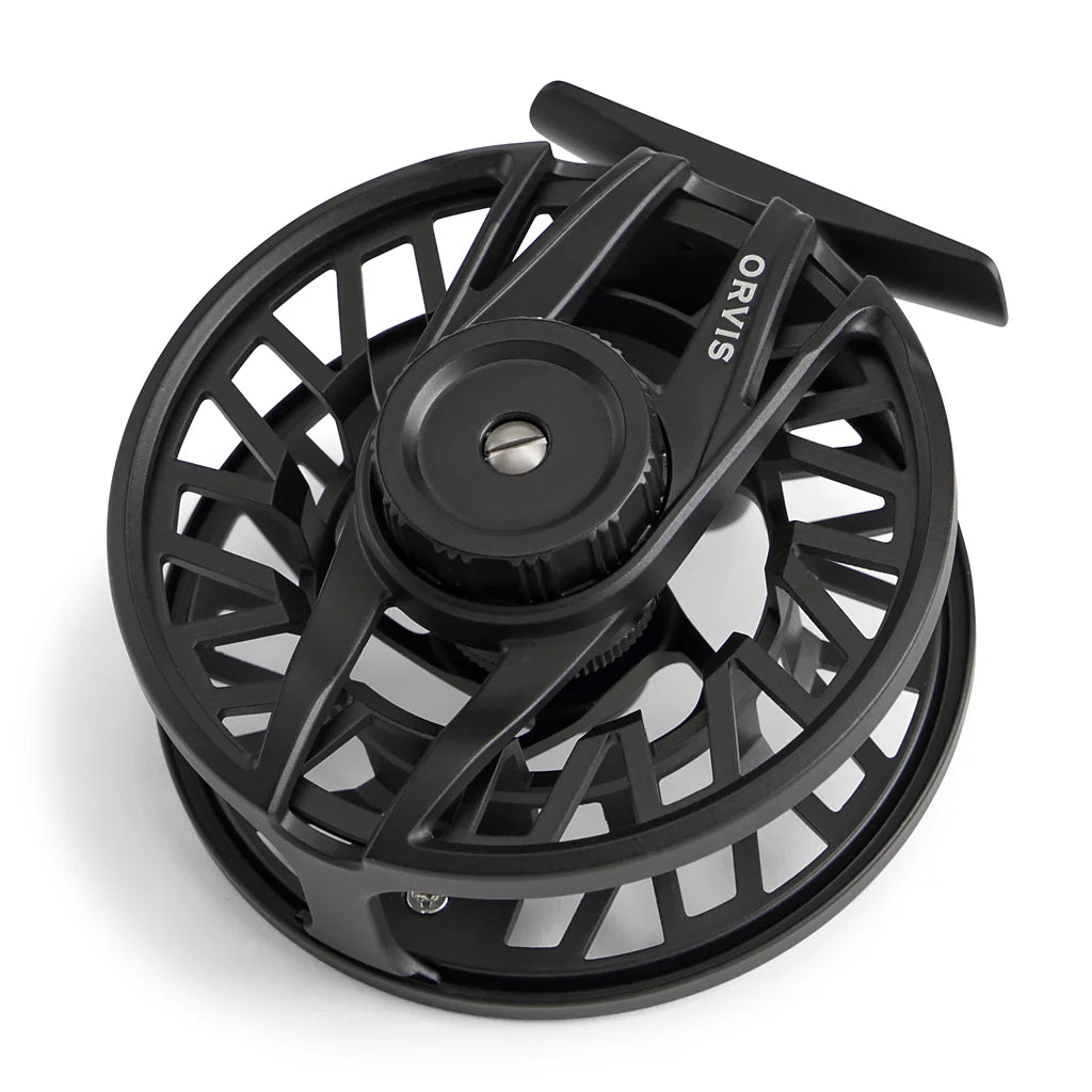 Black Orvis fishing reel on a white background