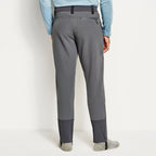A pair of fleece-lined Orvis Men's PRO HD Underwader Pants in gray color, designed for fishing during late fall and winter.