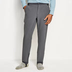 A pair of fleece-lined Orvis Men's PRO HD Underwader Pants in gray color, designed for fishing during late fall and winter.
