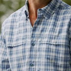 Close-up of a long-sleeve plaid Orvis MEN's Open Air Caster Plaid Long-Sleeve Shirt in blue and white, showing the fabric texture and button-up collar.