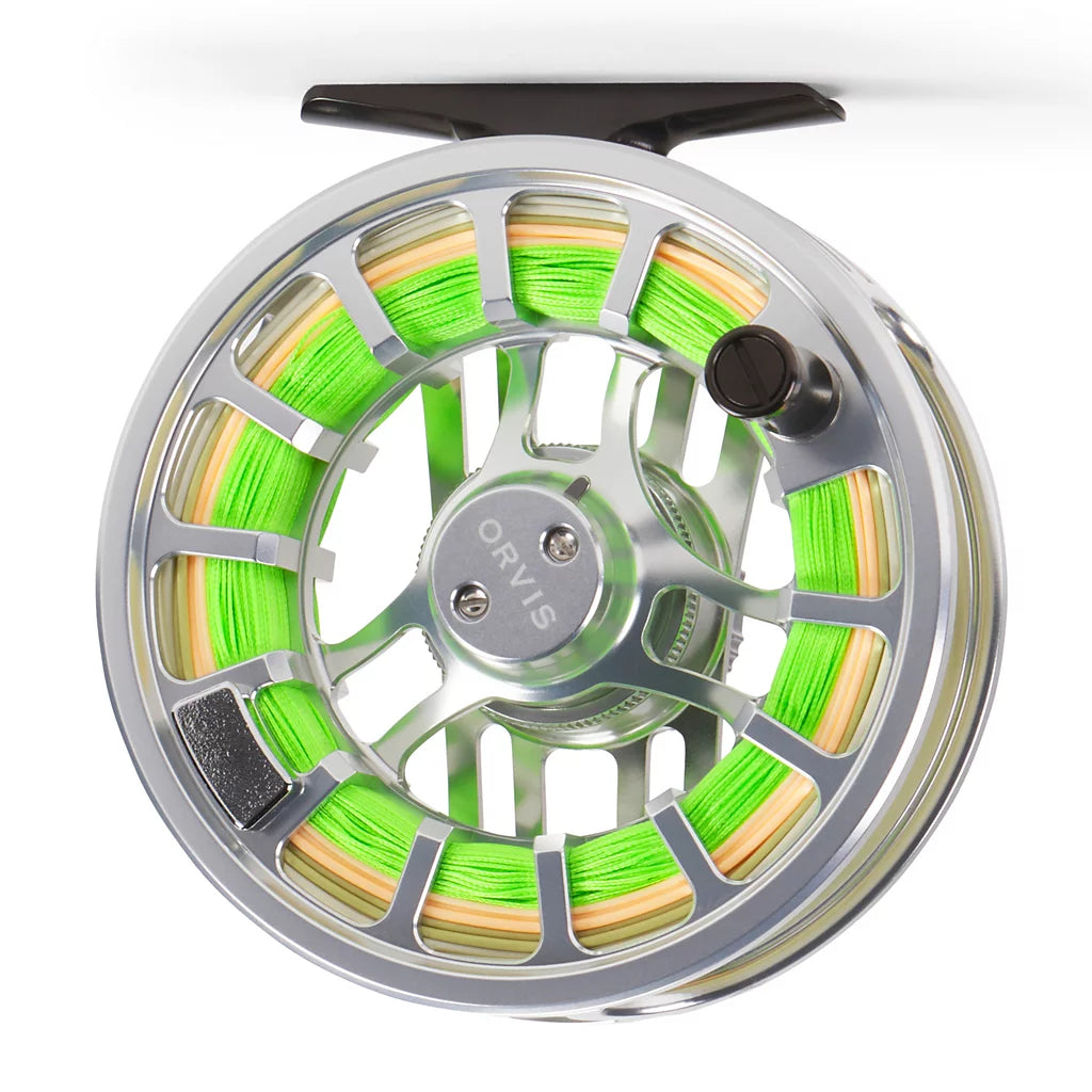 A close-up studio shot of a Orvis Hydros fly fishing reel spool filled with bright neon green line, featuring a polished silver metal frame, a black central hub, and a black handle knob at the top.