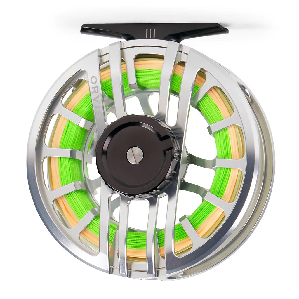 A close-up studio shot of a Orvis Hydros fly fishing reel spool filled with bright neon green line, featuring a polished silver metal frame, a black central hub, and a black handle knob at the top.