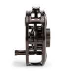 Black metal fishing reel on a white background