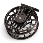 Black fly fishing reel on a white background