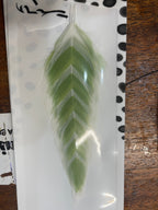 A selection of MFC Galloup's fish feathers for fly tying, displayed in various colors and patterns, including solid white, red, yellow, and more.
