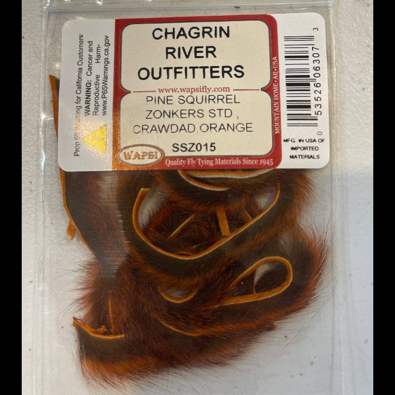 Packaged pine squirrel zonkers with a Chagrin River Outfitters label on a clear background
