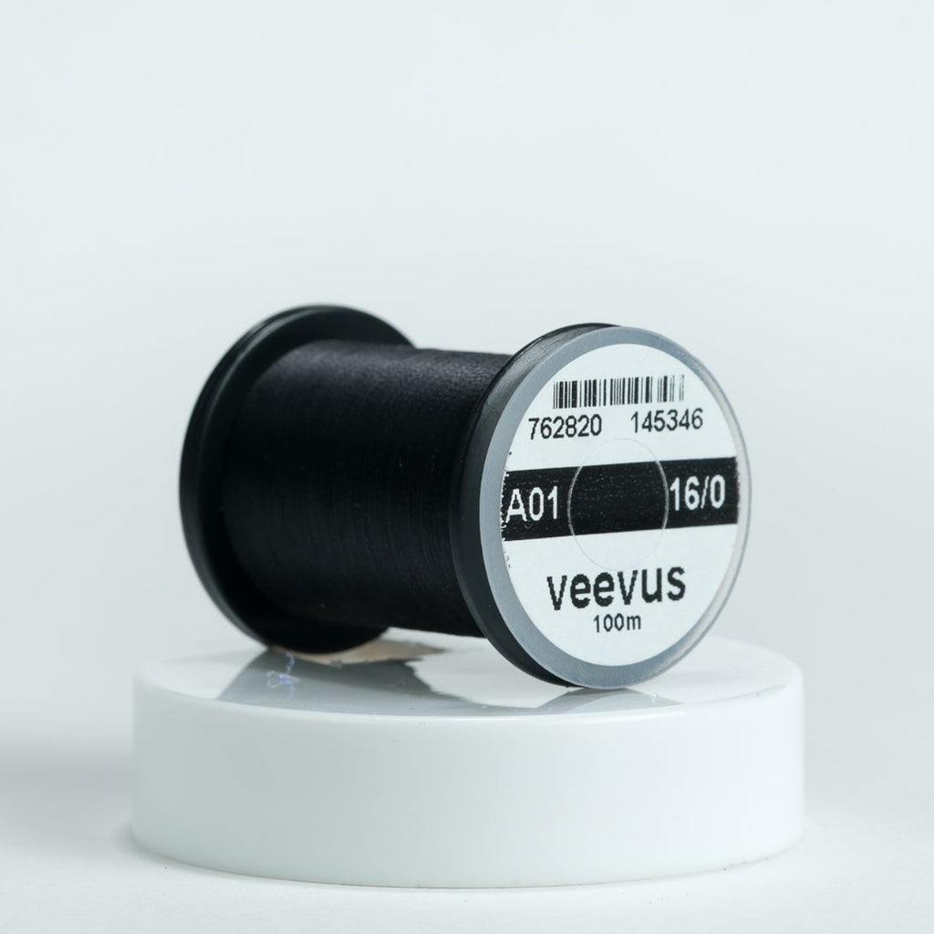 Spool of black Veevus Thread Polyester 16/0 with 'veevus' branding on a white background
