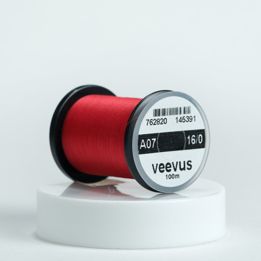 Red spool of Veevus Thread Polyester 16/0 with 'veevus' branding on a white background