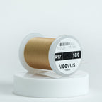 Spool of Veevus thread on a white background