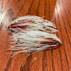 Two single stage intruder fishing flies with silver and gold accents, tied for steelhead fishing.