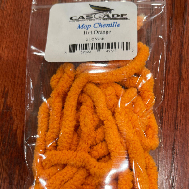 Packaged orange Chenille Mop Craft Supply on a wooden surface