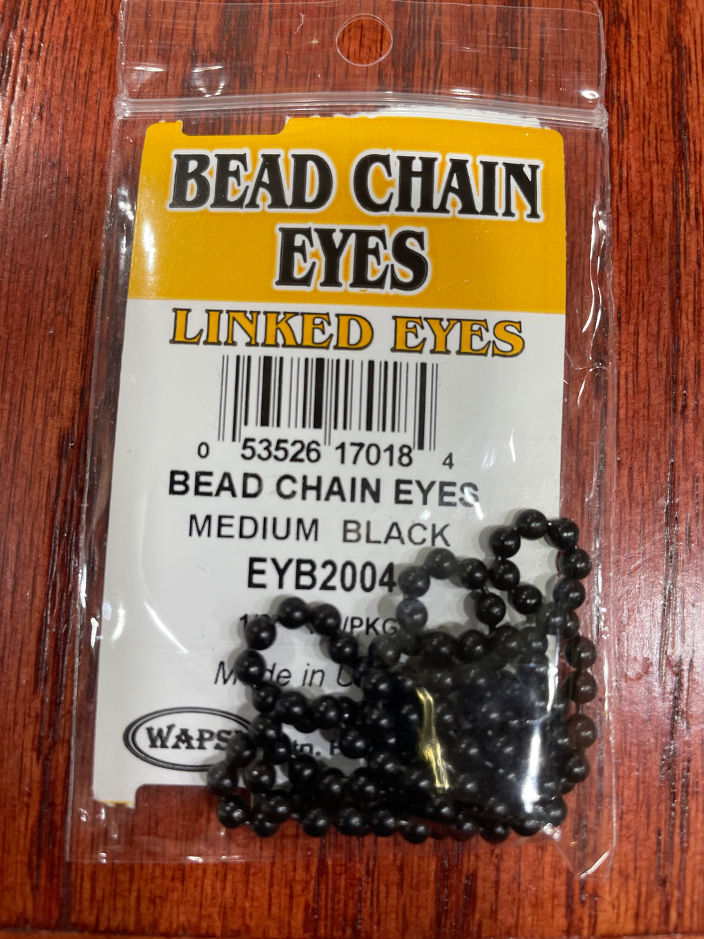Packaged bead chain eyes for fly tying, available in gold and silver colors, displayed on a fly tying kit card.