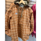 Plaid Simms MEN's Coldweather Hooded Shacket w/CRO Logo with a hood on a hanger against a wooden panel background