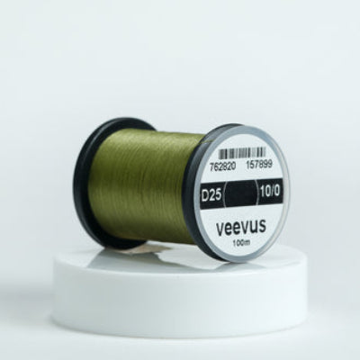 Spool of olive veevus fly-tying thread on a white background