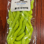 Green Chenille Material in a clear plastic package on a wooden surface with a label.
