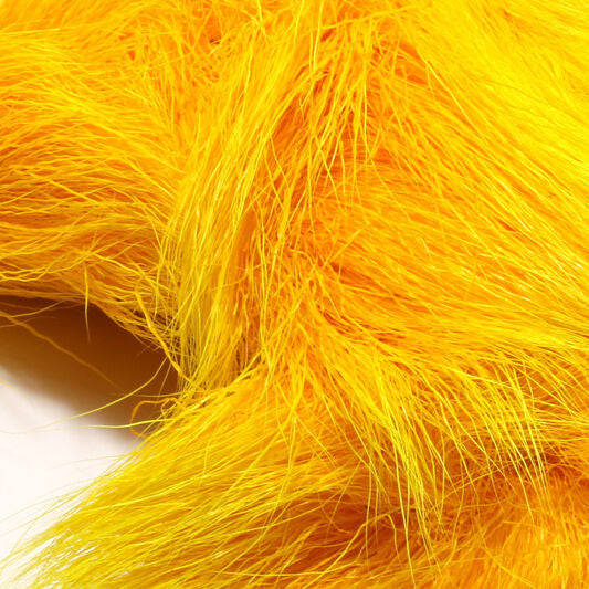 Close-up of bright yellow Hareline Deer Belly Hair