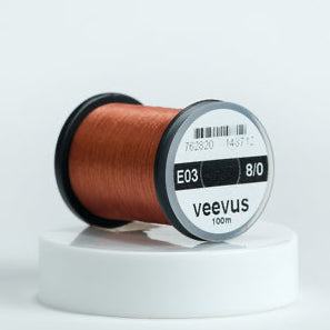 Spool of Veevus Thread Polyester 8/0 with 'veevus' branding on a white background