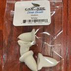 Packaged diver heads with a Cascade label on a wooden surface