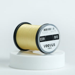 Spool of Veevus Thread Polyester 8/0 with 'veevus' branding on a white background