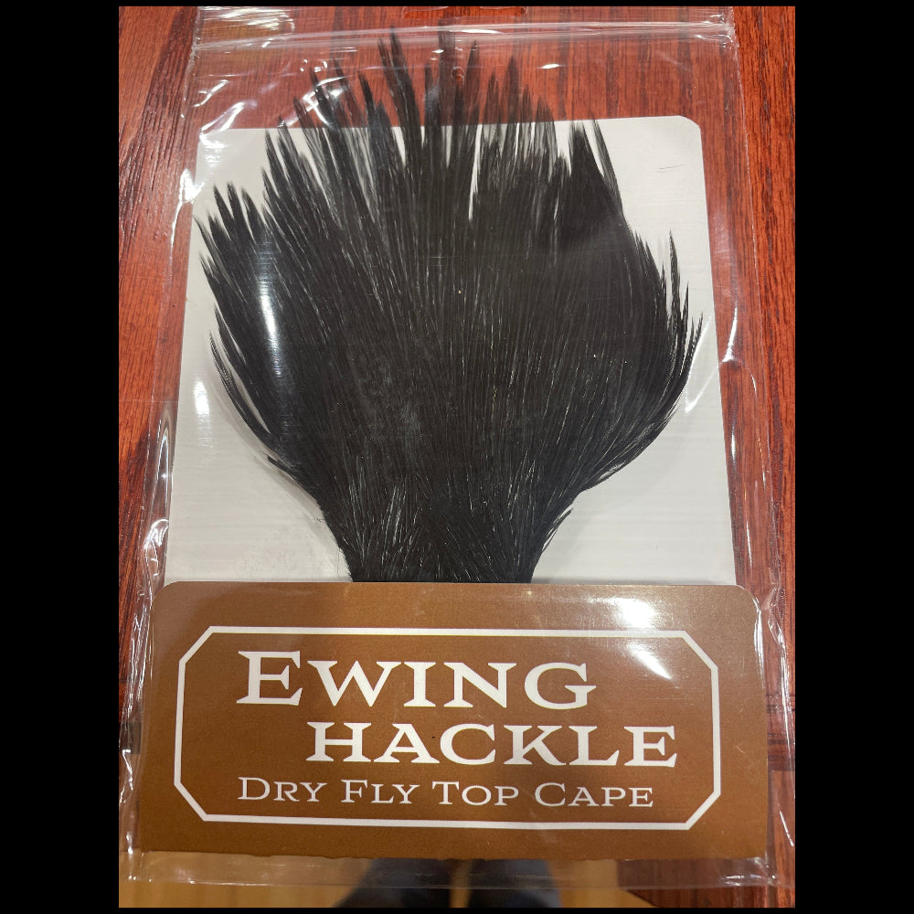 Ewing Hackle dry fly top cape packaging on a wooden surface